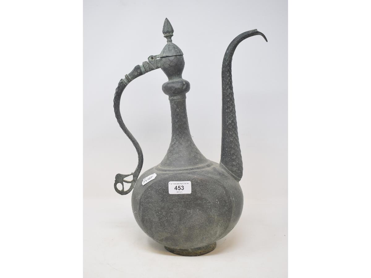 An Islamic bronze ewer and cover, 41 cm high