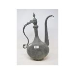 An Islamic bronze ewer and cover, 41 cm high