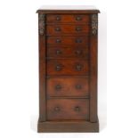 A Victorian mahogany Wellington chest, having seven graduated long drawers, on a plinth base, 59