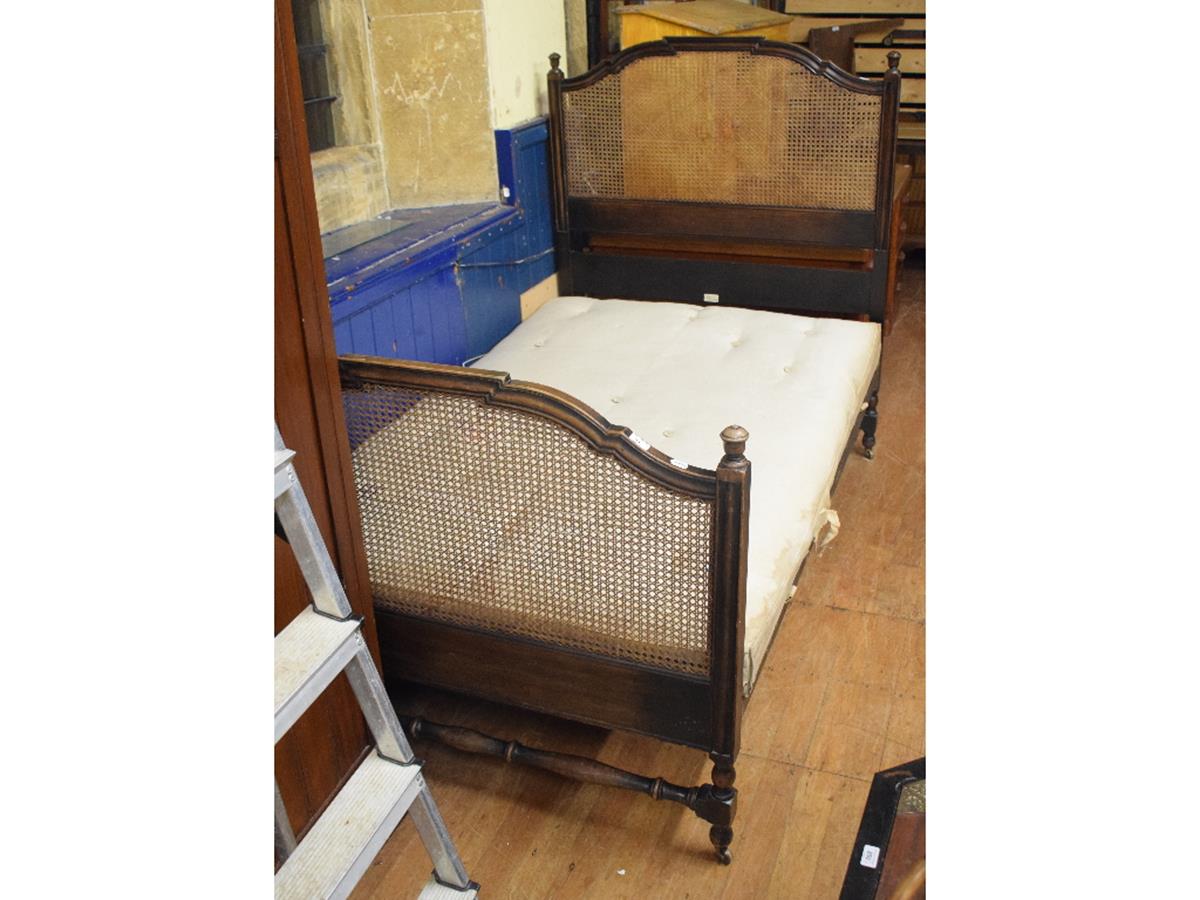 A Heal & Son mahogany bed, with cane work ends, with ivorine maker's plaque to headboard, 122 cm