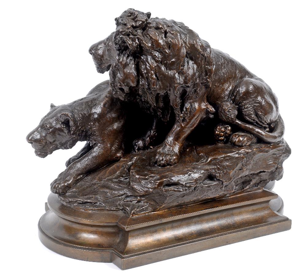 A bronze group of a lion and a lioness, on a rocky mound, indistinctly signed, 29 cm high See - Image 2 of 2