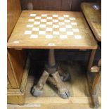 An unusual chess table, with ivory inlay, on zebra legs, 54.5 cm wide See illustration