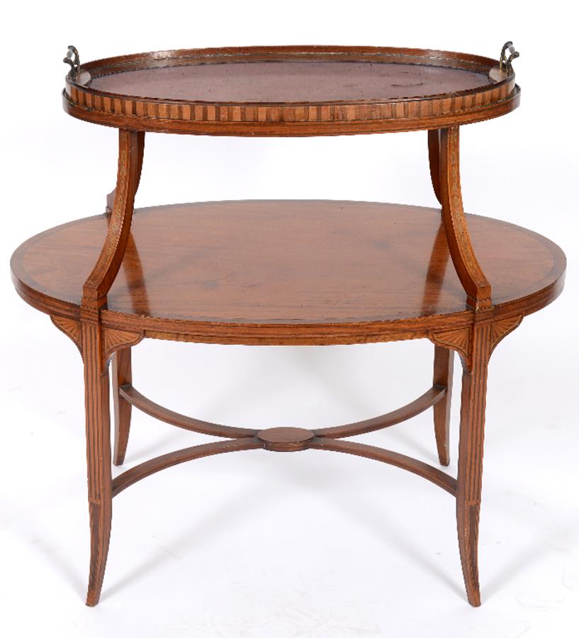 An Edwardian inlaid satinwood oval two tier etagere, with a lift off tray top, and slender splay