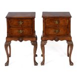 A pair of walnut bedside chests, in the 18th century taste, crossbanded, each having two long