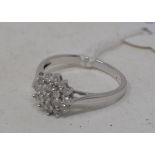 A 9ct white gold and diamond cluster ring, approx. ring size L½ Modern