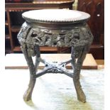 A Chinese hardwood jardiniere stand, with a marble inset top, carved flowers and foliage, 48 cm