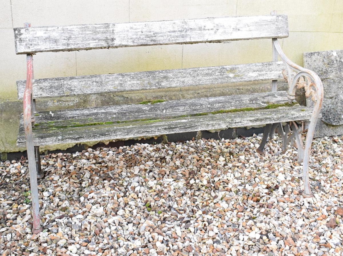 A metal garden bench, with leaf motifs, 136 cm wide