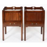 A pair of George III style mahogany tray top night commodes, each with a tambour sliding door