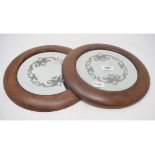 A pair of etched mirror roundels, in oak frames, 27.5 cm diameter (2)