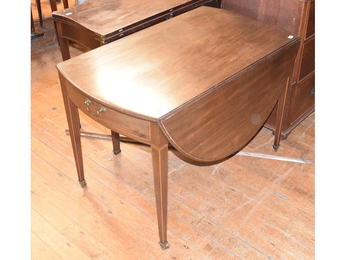 A George III mahogany oval Pembroke table, with boxwood stringing, on tapering square legs, 136 cm