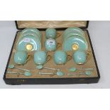 A Royal Worcester porcelain cabinet coffee set, with green glaze and gilt decoration and six