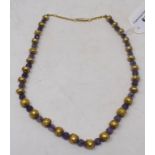 A yellow coloured metal and amethyst necklace, with a 9ct gold clasp