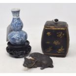 A Chinese scroll weight, in the form of a buffalo, 2.5 cm high, a lacquer box and cover, and a