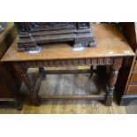 An 18th century style oak table, on turned legs, 99 cm wide