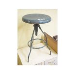 An industrial painters metal adjustable stool