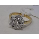 A 9ct gold and seven stone diamond flowerhead ring, approx. ring size N Modern