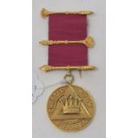 A 12ct gold Masonic medallion Report by NG Approx. 26.3 g (all in). The medallion is stamped 12C and