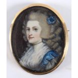 An oval bust portrait miniature, of a lady with ringlets and a blue flower in her hair, watercolour,