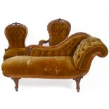 A Victorian carved walnut three piece parlour suite, comprising a chaise longue, an armchair, and