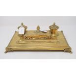 A 19th century gilt metal inkstand, applied two ornate inkwells, 34 cm wide, and a matching