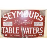A Seymour's Table Waters Sherborne enamel sign, some loss, 38 x 61 cm, a Gibbs ashtray, and a