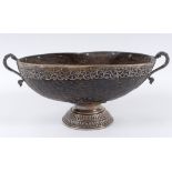 A Colonial Coco-de-Mer bowl, with silver coloured metal mounts, 34 cm wide See illustration Report