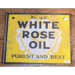A double sided enamel advertising sign, We Sell White Rose Oil Purest And Best, with hanging flange,