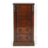 A Victorian mahogany Wellington chest, having seven graduated long drawers, on a plinth base, 59