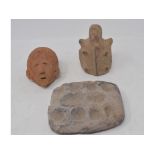 An African native style terracotta head, 9.5 cm, and two other items (3)