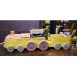 A painted wood toy train, 39 cm long, a metal toy oven and other toys (box)