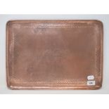 A Newlyn beaten copper rectangular tray, stamped makers mark, 46 cm wide