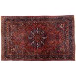 A pair of Moud carpets, decorated floral motifs on dark blue grounds, within multi-borders, 207 x