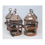 A set of four copper hanging lanterns, 29 cm high (4)