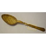 A 19th century Continental carved horn spoon, with incised decoration, 20.5 cm high