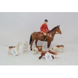 A Beswick Huntsman, brown, 1501, a Fox, standing, 1440, and four Foxhounds, 2262, 2263, 2264 and