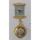 A 9ct gold Masonic medallion, with enamel decoration, enamel damage Report by NG Approx.38.0 g (