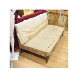 A 19th century daybed, on turned front legs, lacking upholstery, 176 cm wide