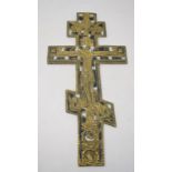 A Russian Orthodox cross, with cast and enamel decoration, the reverse inscribed with cyrillic text,