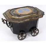 An unusual toleware carriage, the top inset a glass panel, and with gilt decoration, the interior