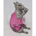 A ruby glass and plated claret jug, in the form of a squirrel, 18.5 cm high Report by NG This is a