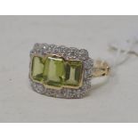 A 9ct gold, peridot and diamond cluster ring, approx. ring size O Report by NG This is a modern item