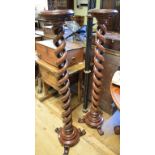 A pair of Victorian mahogany jardiniere stands, of spiral twist form, on turned bases with three