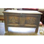 A carved oak coffer, of small proportions, on stile legs, 101 cm wide Image request