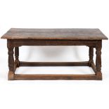 An oak refectory table, the two plank top on turned legs joined by stretchers, 17th century and with