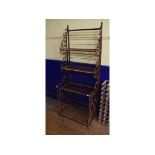 A wrought iron four tier étagère, 75 cm wide Report by GH Total height - 198 cm, max. depth 51 cm.