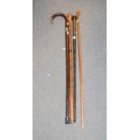 A silver mounted walking cane, and three other walking canes (4)