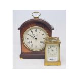 A Comitti mantel clock, 24 cm high, and a carriage timepiece, in a brass case, 16 cm high (2)