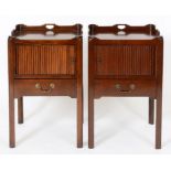 A pair of George III style mahogany tray top night commodes, each with a tambour sliding door