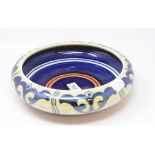 A Bursley Ware lustre bowl, cracked, 25.5 cm diameter, a Royal Doulton toothbrush holder,