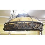 A large wrought iron ceiling hanging light, decorated foliate motifs, 82 cm diameter